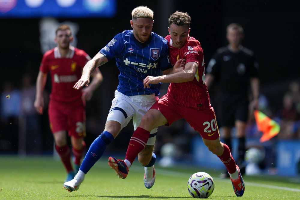 Ipswich Town's Wes Burns goes up against Diogo Jota of Liverpool Ipswich Town's Wes Burns goes up against Diogo Jota of Liverpool
