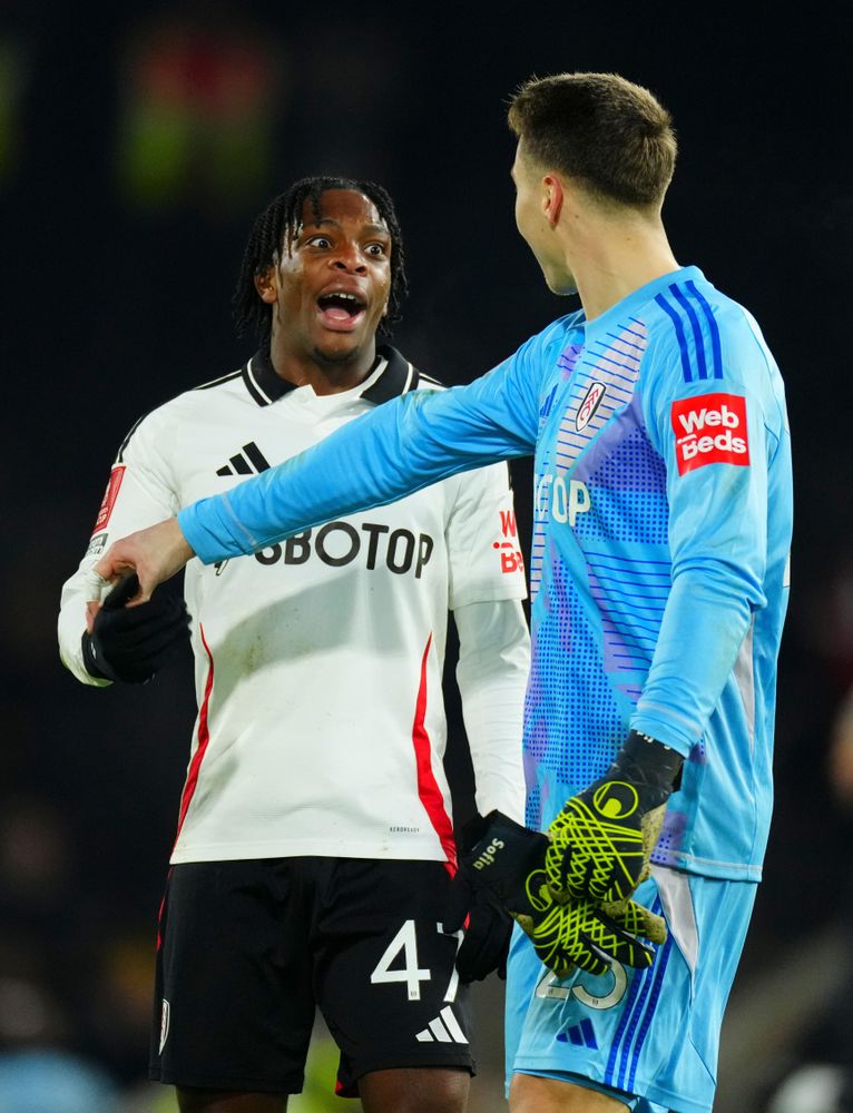 Martial Godo celebrates with Steven Benda after Fulham's win over Watford