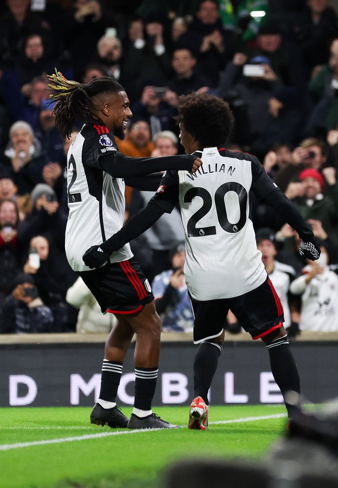 Willian celebrates his second penalty with Alex Iwobi Willian celebrates his second penalty with Alex Iwobi