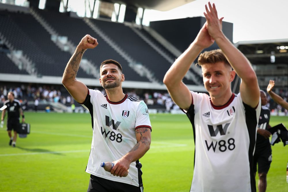 Aleksandar Mitrović and Tom Cairney celebrate the victory Aleksandar Mitrović and Tom Cairney celebrate the victory