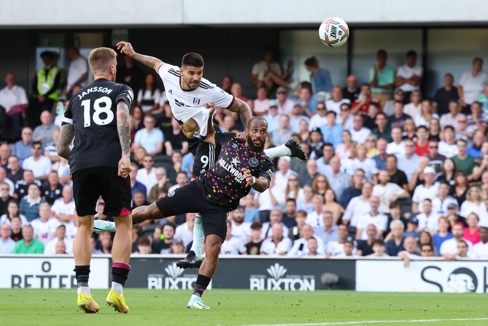 Aleksandar Mitrović rises above Bryan Mbeumo to power home the winner Aleksandar Mitrović rises above Bryan Mbeumo to power home the winner