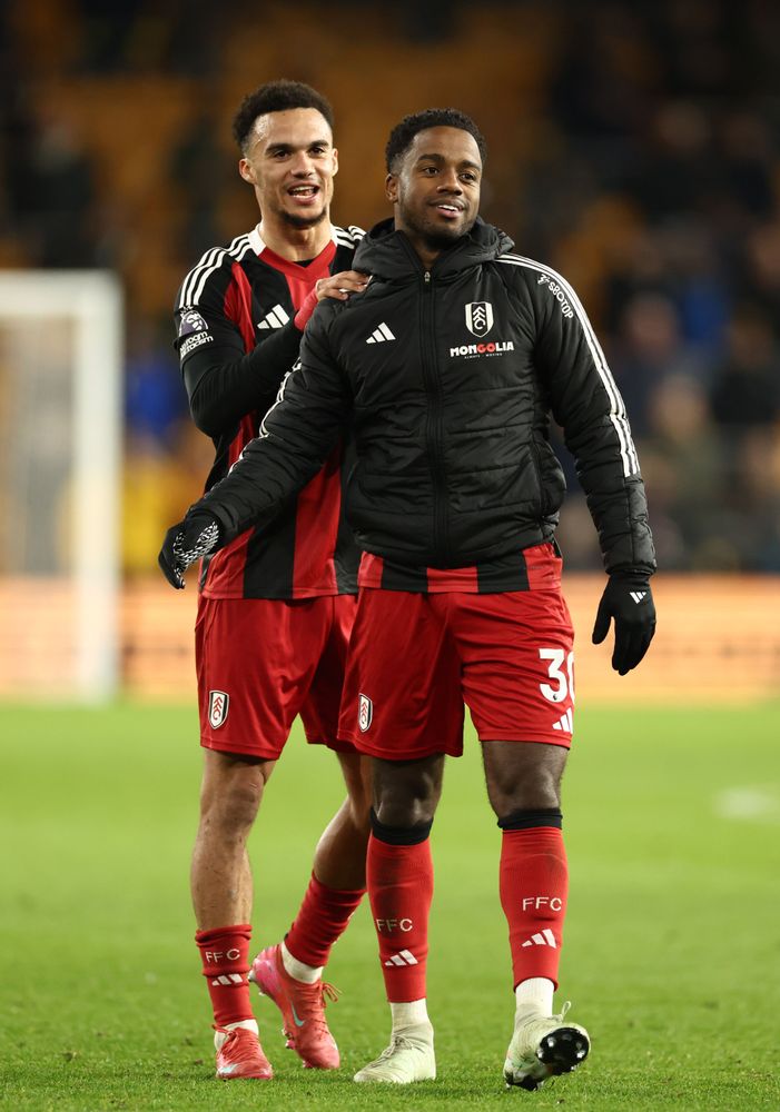 Antonee Robinson and Ryan Sessegnon celebrate with the Fulham fans at full-time Antonee Robinson and Ryan Sessegnon celebrate with the Fulham fans at full-time