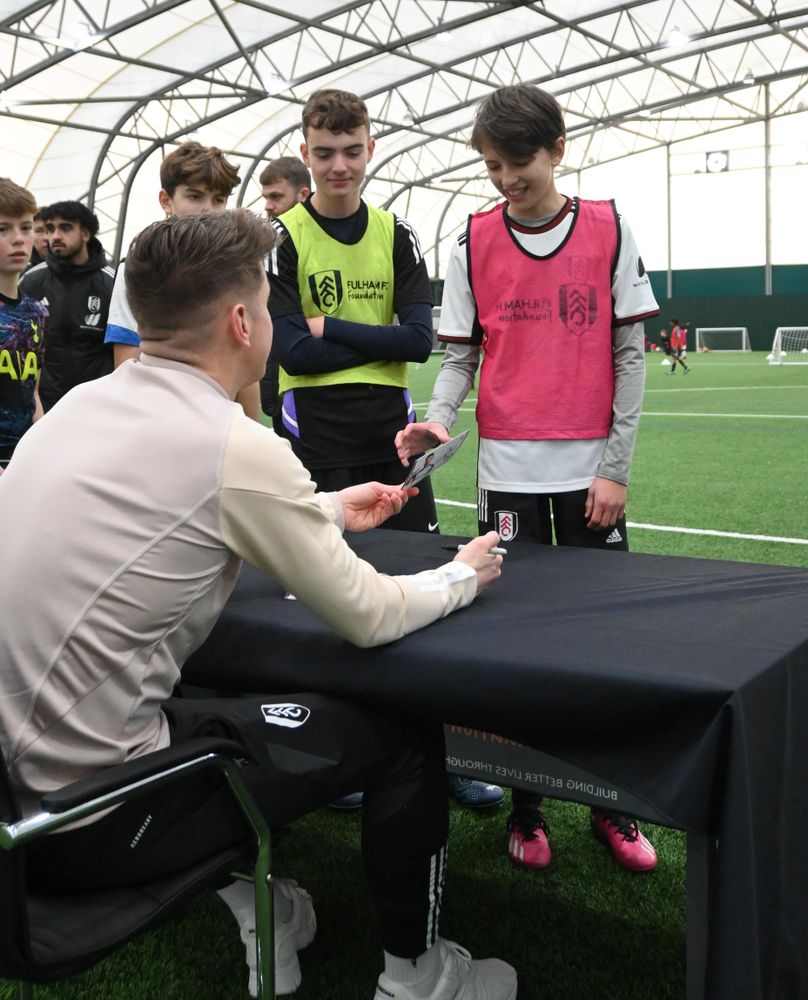 Tom Cairney signs autographs for Soccer School participants Tom Cairney signs autographs for Soccer School participants