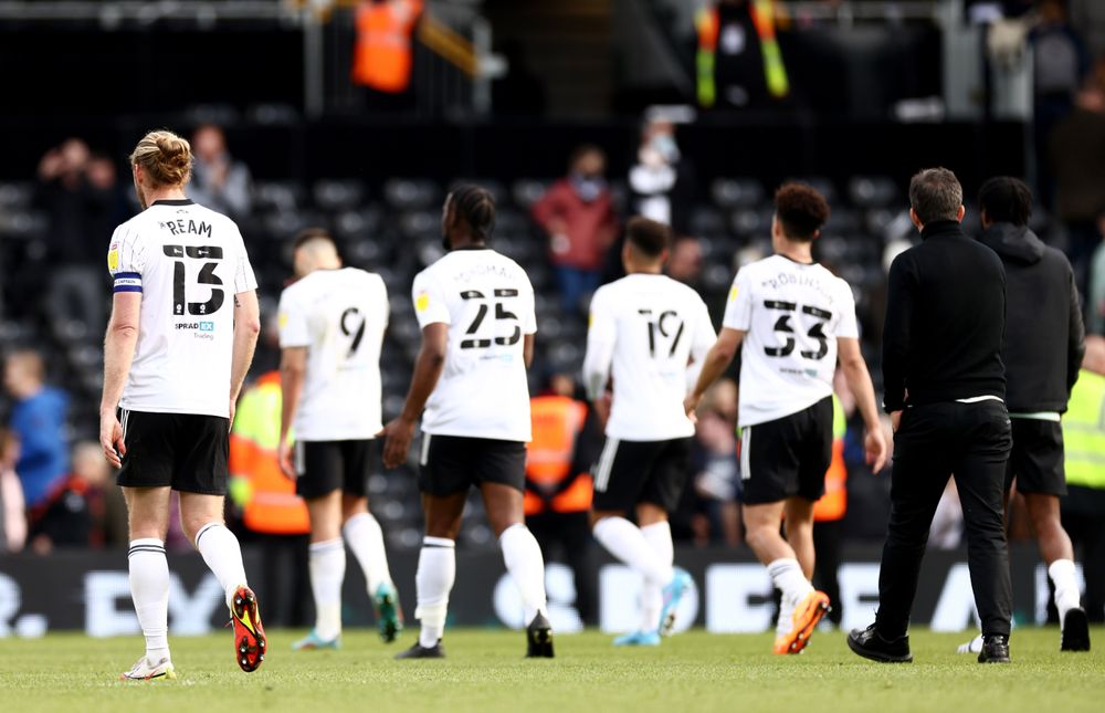 The players and Marco walk off the Craven Cottage pitch The players and Marco walk off the Craven Cottage pitch