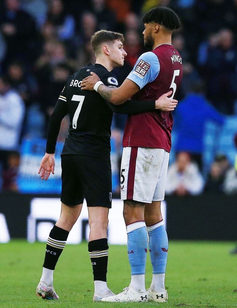 Tyrone Mings embraces David Brooks following the winger's return to action Tyrone Mings embraces David Brooks following the winger's return to action