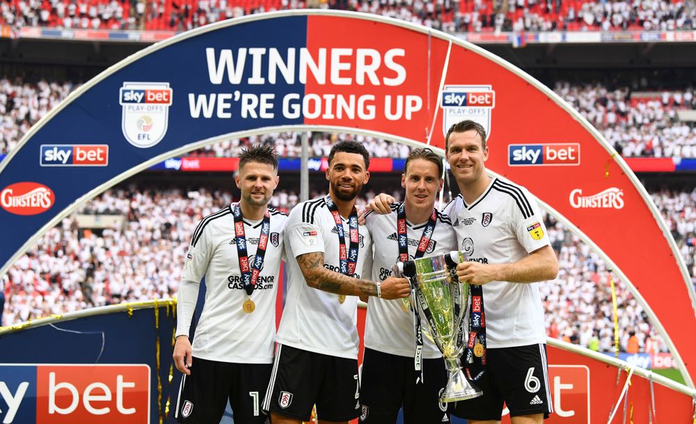 Ollie Norwood, Ryan Fredericks, Stefan Johansen and Kevin McDonald celebrate promotion Ollie Norwood, Ryan Fredericks, Stefan Johansen and Kevin McDonald celebrate promotion