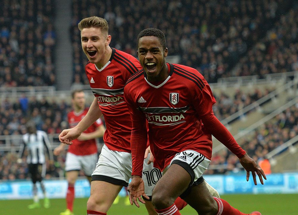 Ryan Sessegnon celebrates with Tom Cairney after scoring against Newcastle