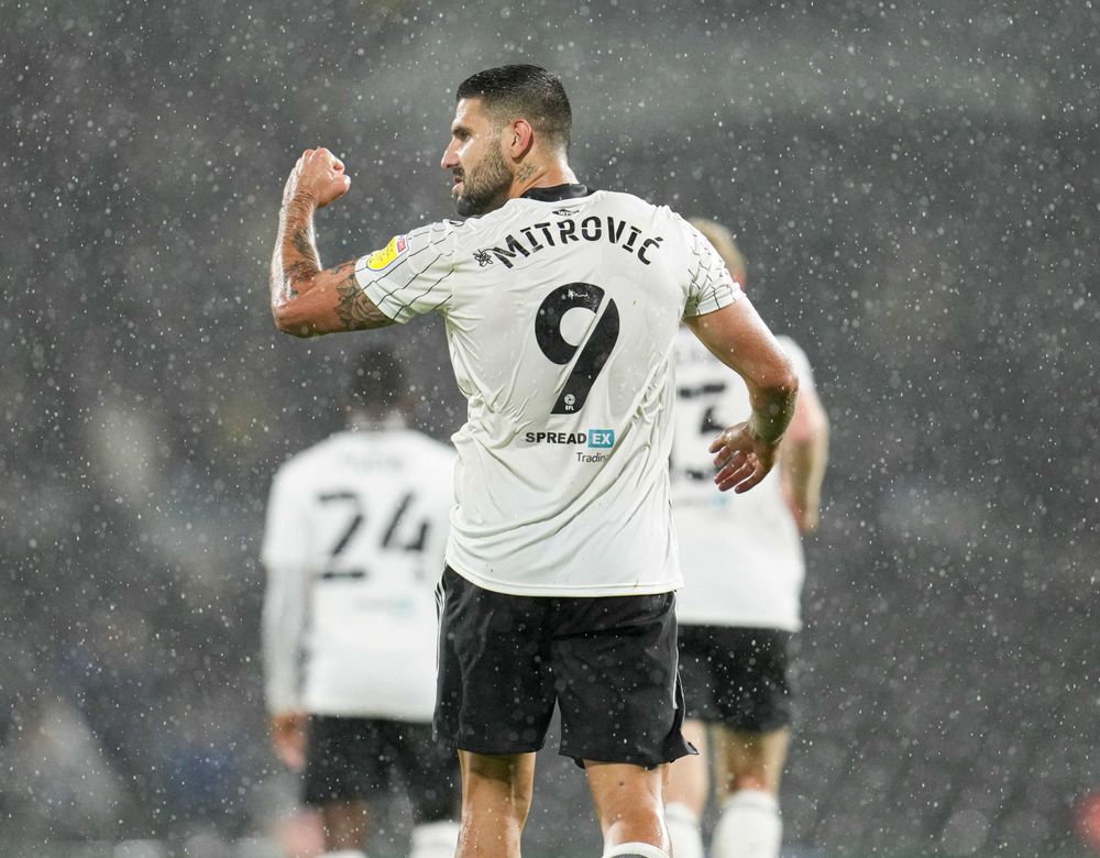Aleksandar Mitrović celebrates scoring Fulham's second against Cardiff
