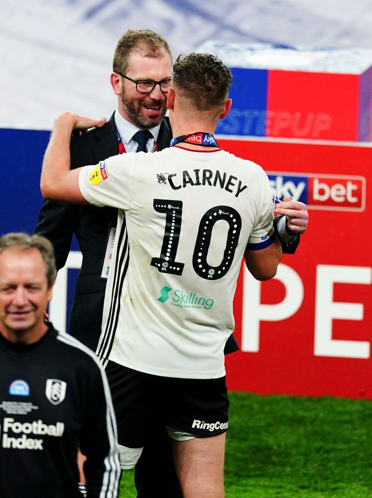 Fulham COO Darren Preston celebrates with Tom Cairney