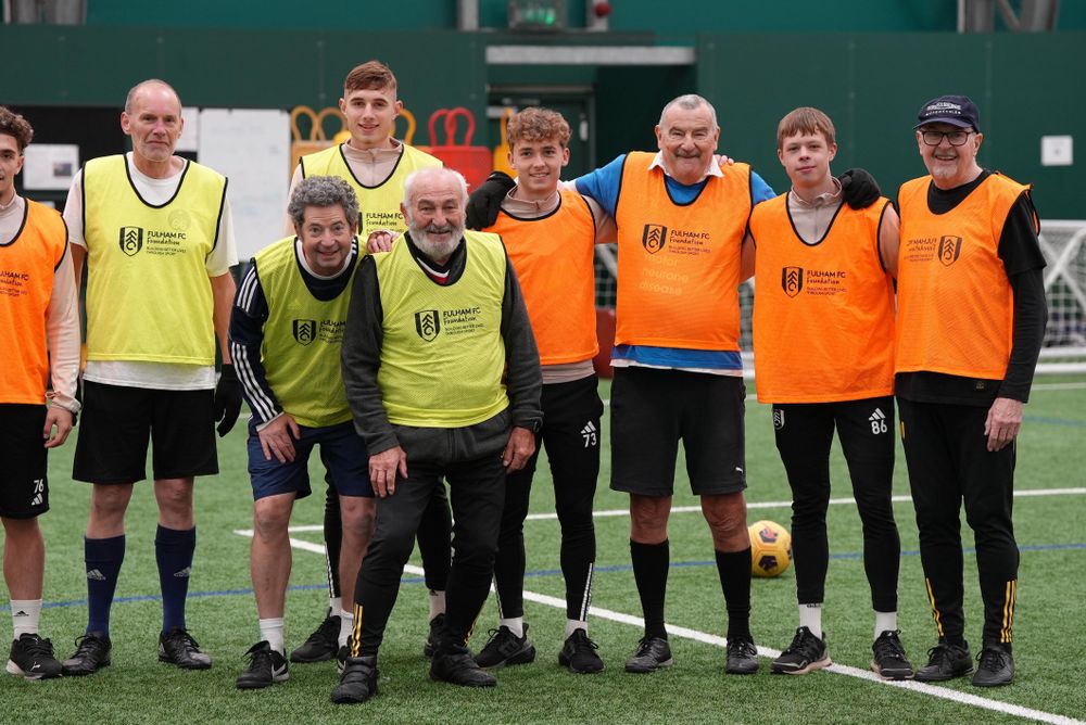 Walking football participants with Academy players Walking football participants with Academy players
