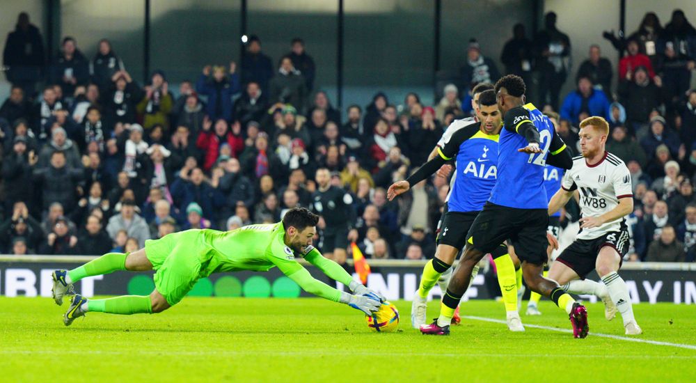 Hugo Lloris just about beats Harrison Reed to the ball