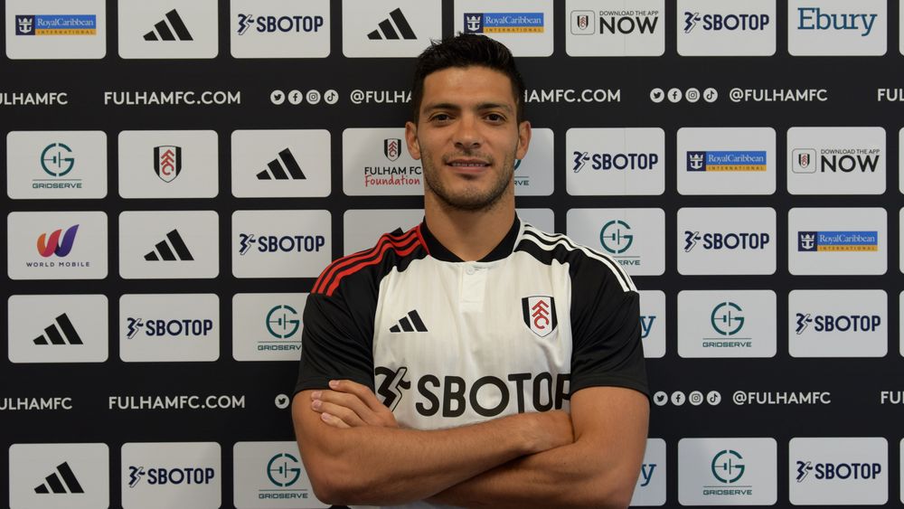 Raúl Jiménez poses in front of the sponsors backdrop Raúl Jiménez poses in front of the sponsors backdrop