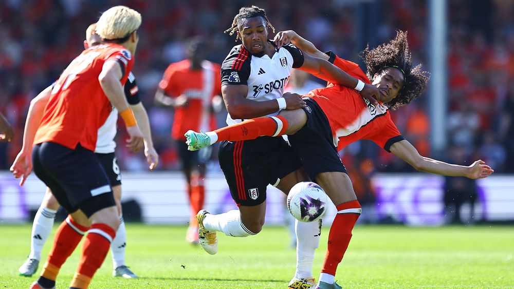 Fulham forward Adama battles for possession with Luton Town's Tahith Chong Fulham forward Adama battles for possession with Luton Town's Tahith Chong