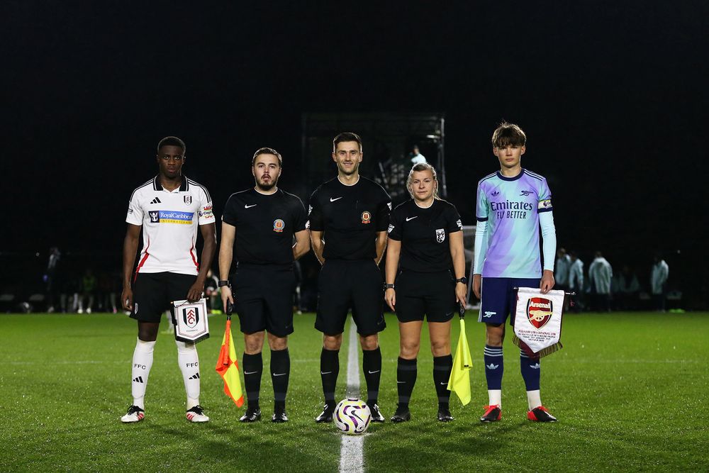 The captains line up pre-match