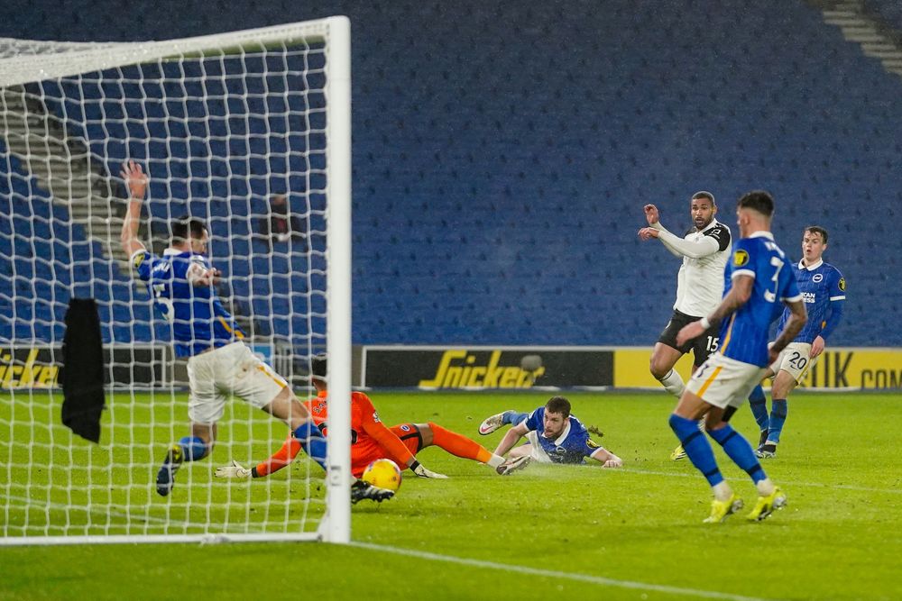 Lewis Dunk blocks Ruben Loftus-Cheek's shot on the line