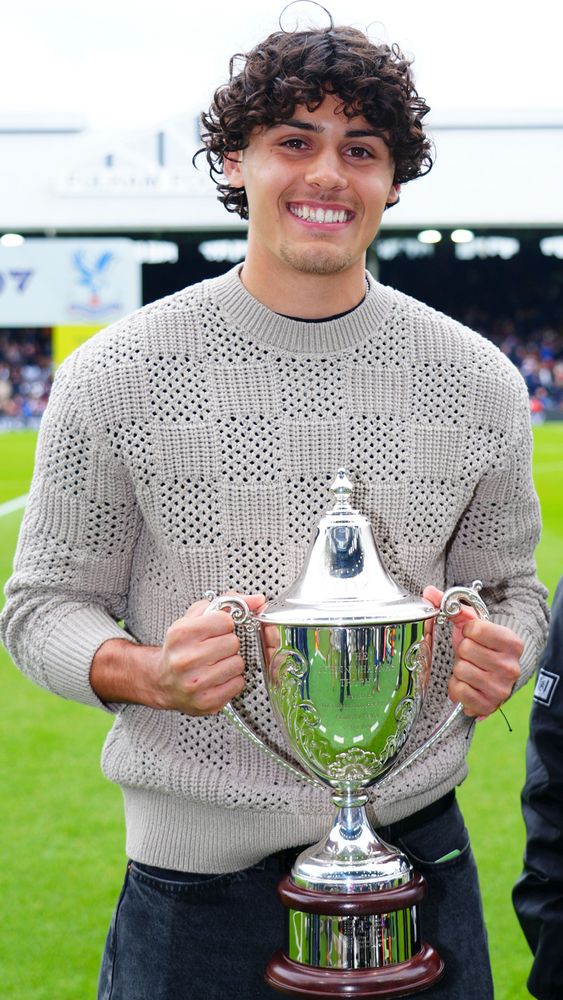 Devan Tanton poses with the Johnny Haynes Trophy Devan Tanton poses with the Johnny Haynes Trophy